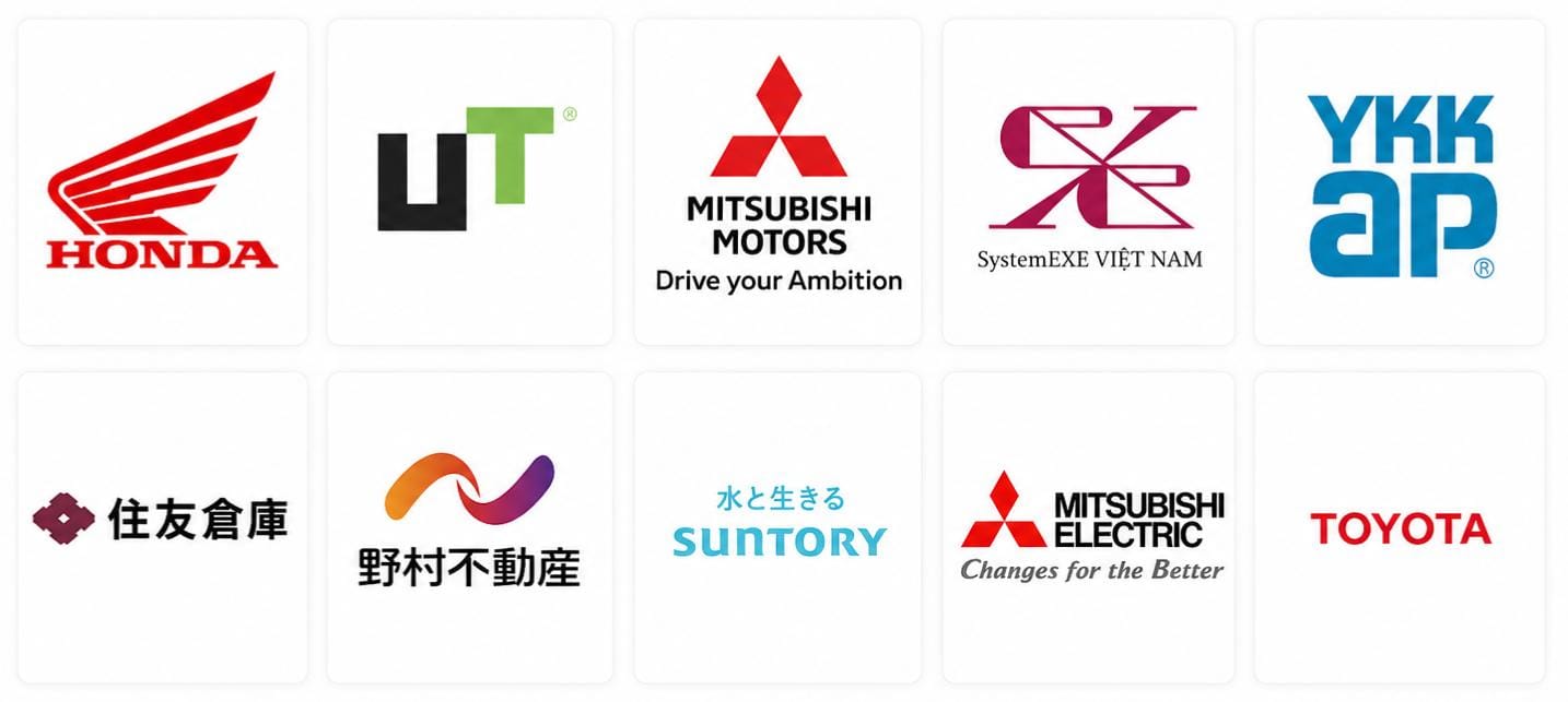 Grid of ten white tiles each displaying a different corporate logo Honda UT Mitsubishi Motors SystemEXE Việt Nam YK AP Sumitomo Warehouse Nomura Real Estate Suntory Mitsubishi Electric Toyota